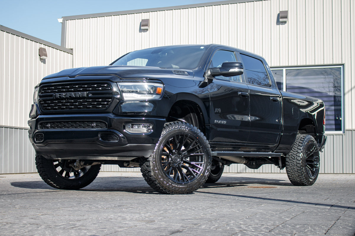 2022 Ram 1500 Big Horn with a 6" Rough Country lift kit, 22x12 Fuel Rebar wheels, and 35" Fury Country Hunter R/T tires.