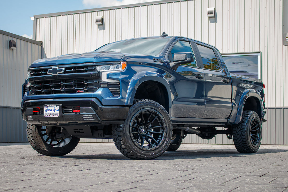 2022 Chevrolet Silverado 1500 LT Trail Boss with a 6" Rough Country lift kit, 22x12 Fuel Rebel wheels, and 35" Fury Country Hunter R/T tires.