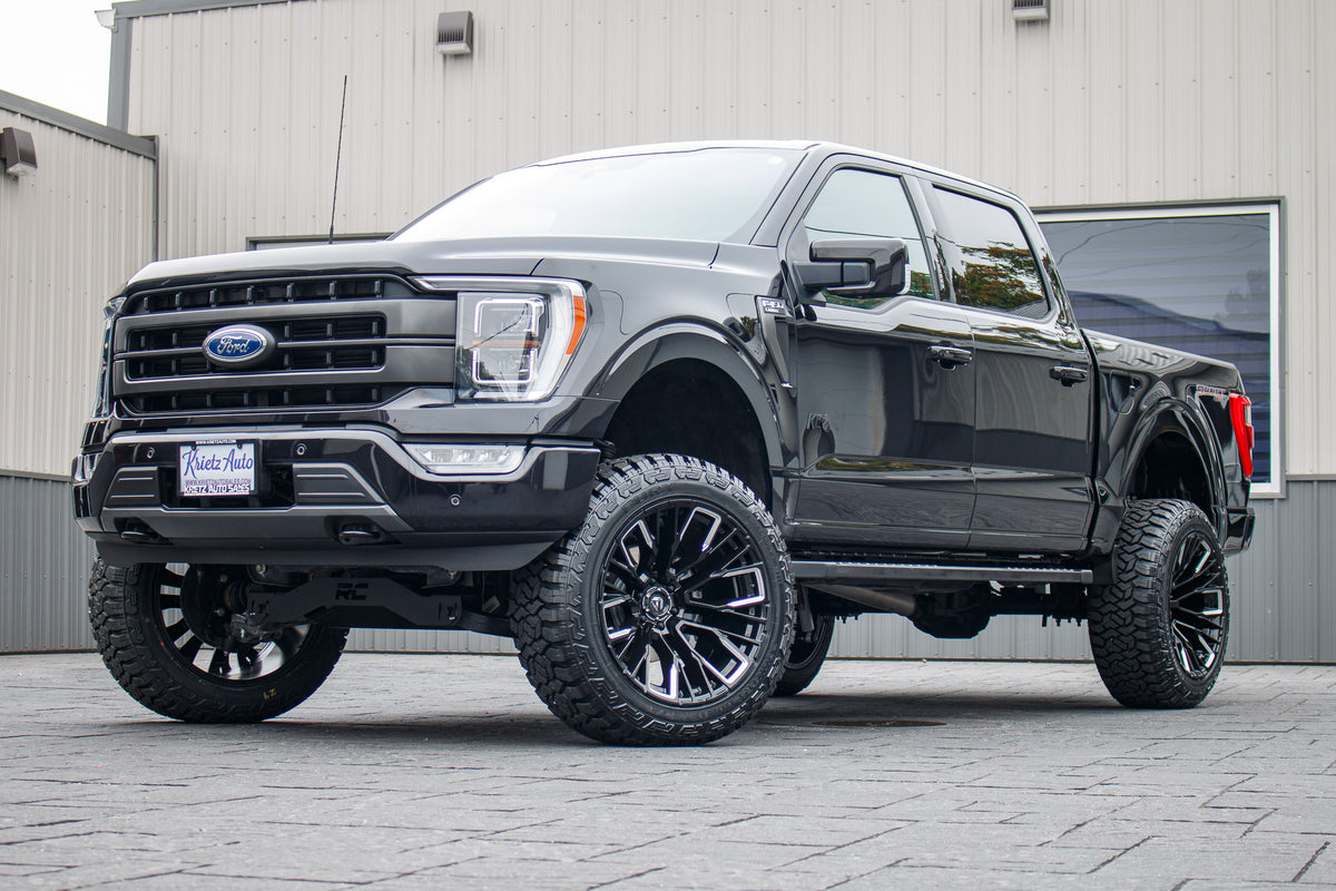 2023 Ford F-150 XLT with a 6" Rough Country lift kit, 22x12 Fuel Rebar wheels, and 35" Fury Country Hunter R/T tires.