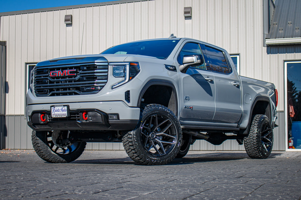 2024 GMC Sierra 1500 AT4 with a 6" Rough Country lift kit, 22x12 Fuel Flux wheels, and 35" Fury Country Hunter R/T tires.