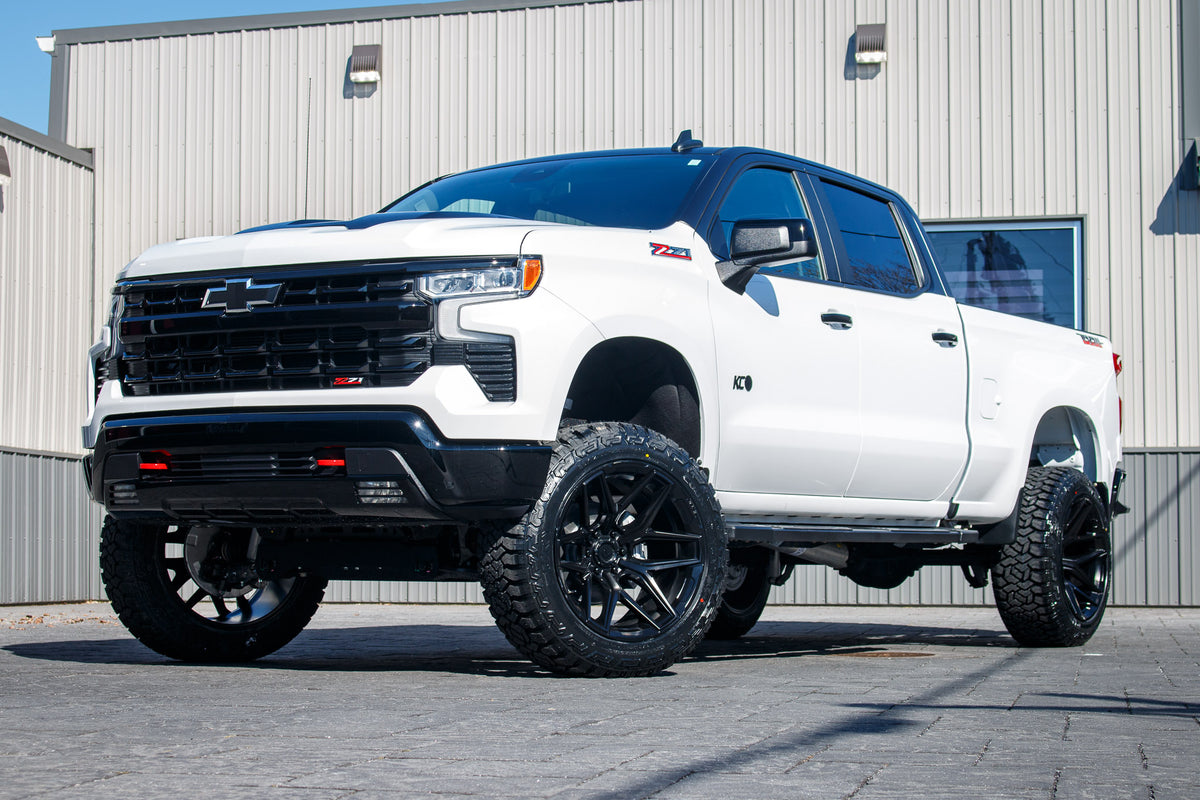 2024 Chevrolet Silverado 1500 LT Trail Boss with a 6" Rough Country lift kit, 22x12 4Play 4P83 wheels, and 35" Fury Country Hunter R/T tires.