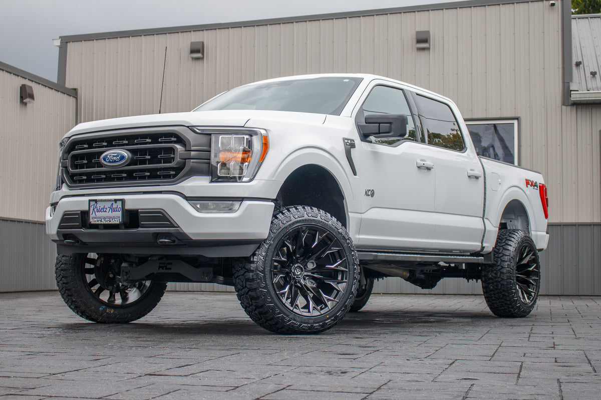 2022 Ford F-150 XLT with a 6" Rough Country lift kit, 22x12 Fuel Flame wheels, and 35" Fury Country Hunter R/T tires.