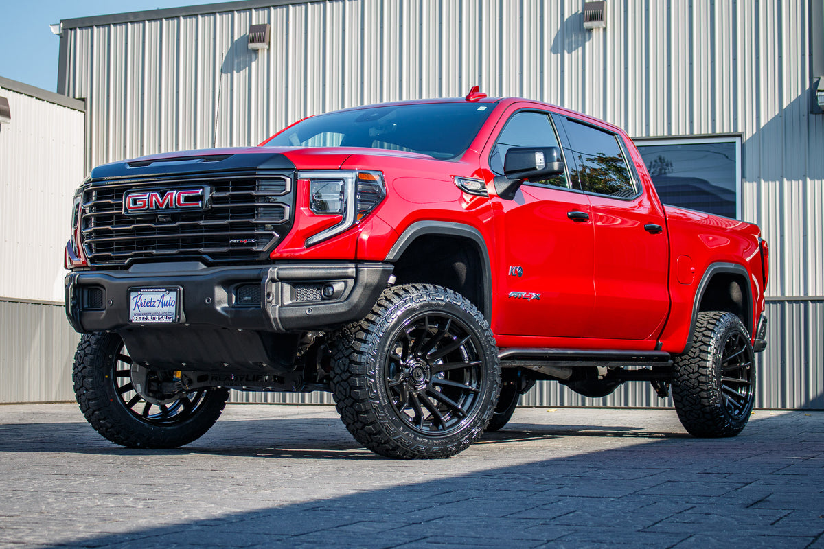 2023 GMC Sierra 1500 AT4X with a 4" ReadyLift lift kit, 22x12 Fuel Burn wheels, and 35" Fury Country Hunter R/T tires.