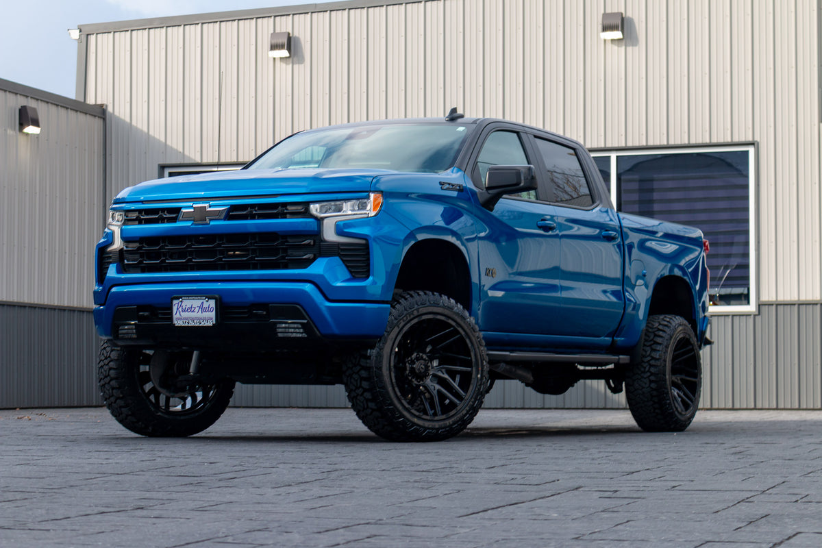 2023 Chevrolet Silverado 1500 RST with a 6" Rough Country lift kit, 22x12 TIS 554B wheels, and 35" Fury Country Hunter R/T tires.