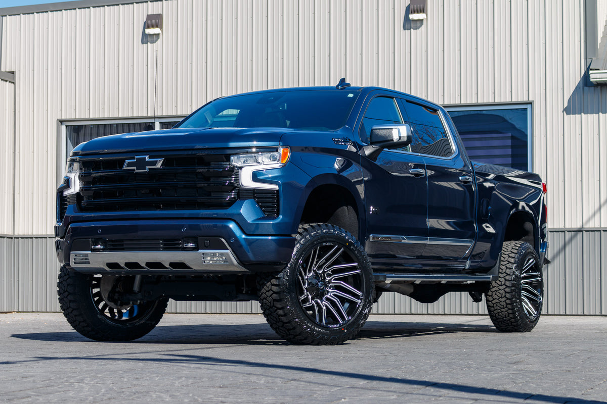 2022 Chevrolet Silverado 1500 High Country with a 6" Rough Country lift kit, 22x12 Fuel Typhoon wheels, and 35" Fury Country Hunter R/T tires.