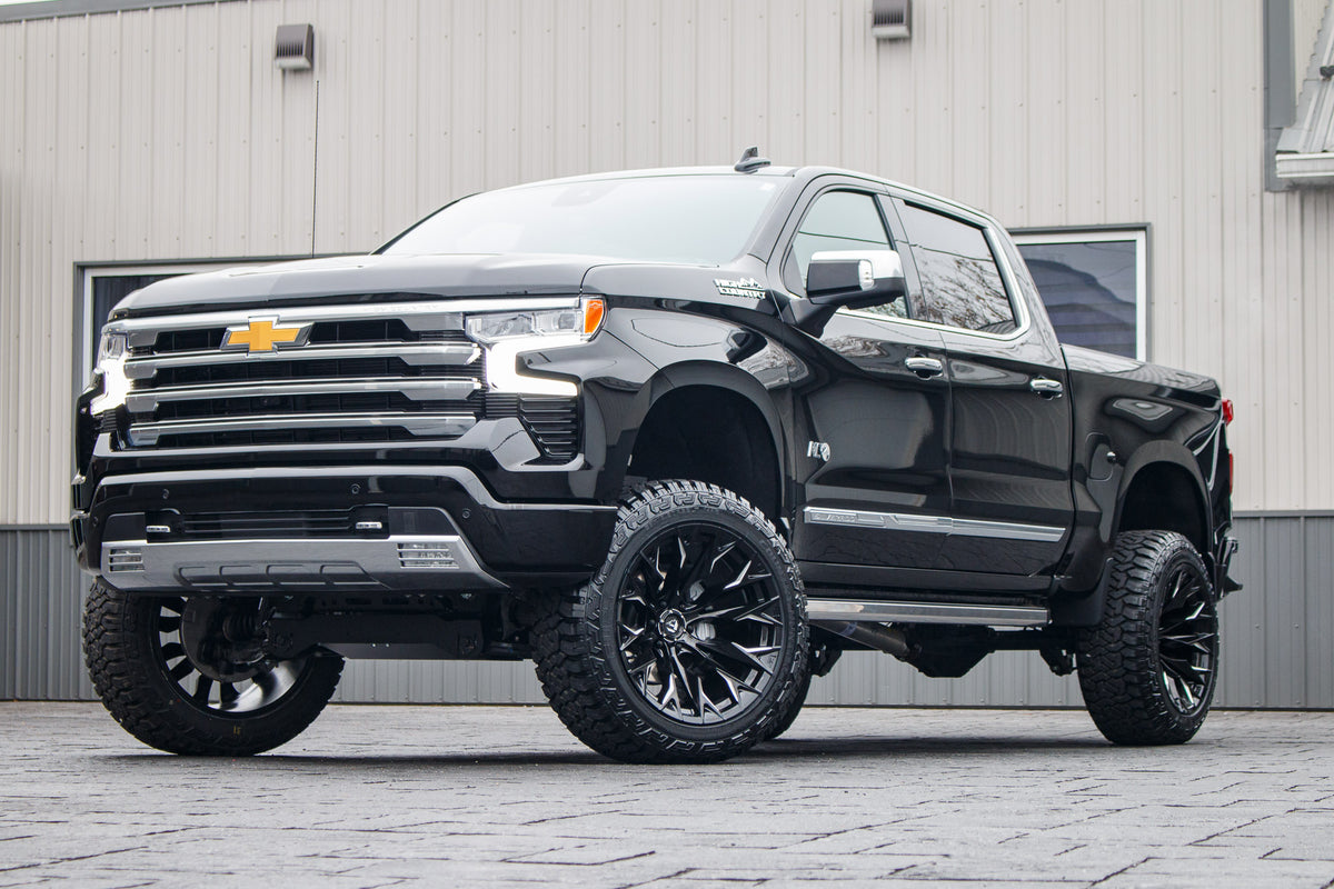 2024 Chevrolet Silverado 1500 High Country with a 6" Rough Country suspension kit, 22x12 Fuel Flame wheels, and 35" Fury Country Hunter R/T tires.
