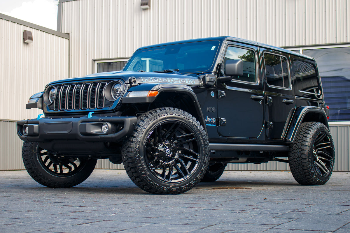 2024 Jeep Wrangler Unlimited Rubicon 4XE with Jeep Stock suspension, 22x12 Fuel Typhoon wheels, and 35" Fury Country Hunter R/T tires.