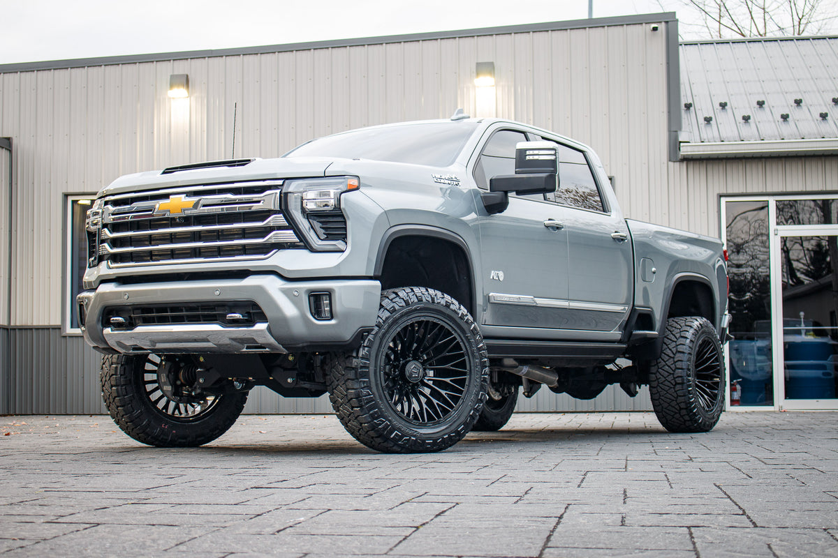 2024 Chevrolet Silverado 3500 High Country with a 5" BDS lift kit, 22x12 TIS 566B wheels, and 37" Nitto Ridge Grappler tires.