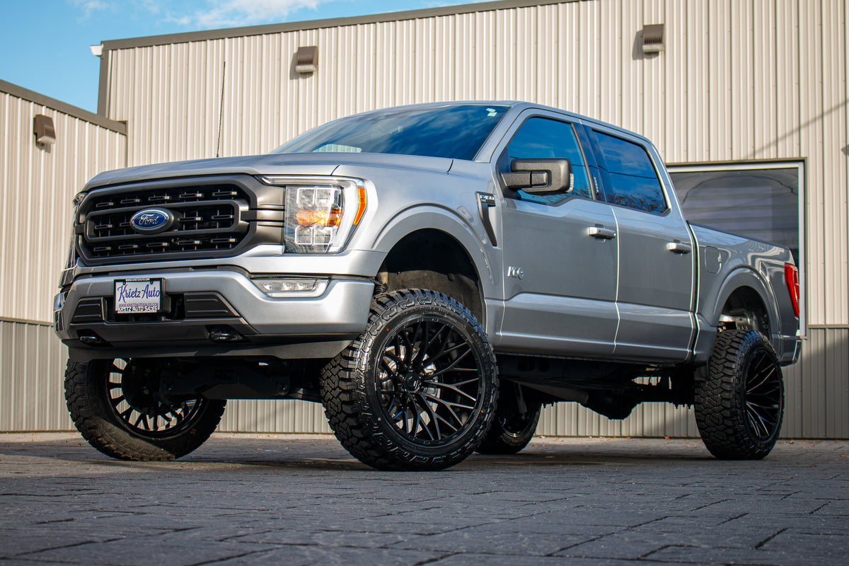 2021 Ford F-150 XLT with a 6" Rough Country lift kit, 22x12 TIS 566B wheels, and 35" Fury Country Hunter R/T tires.
