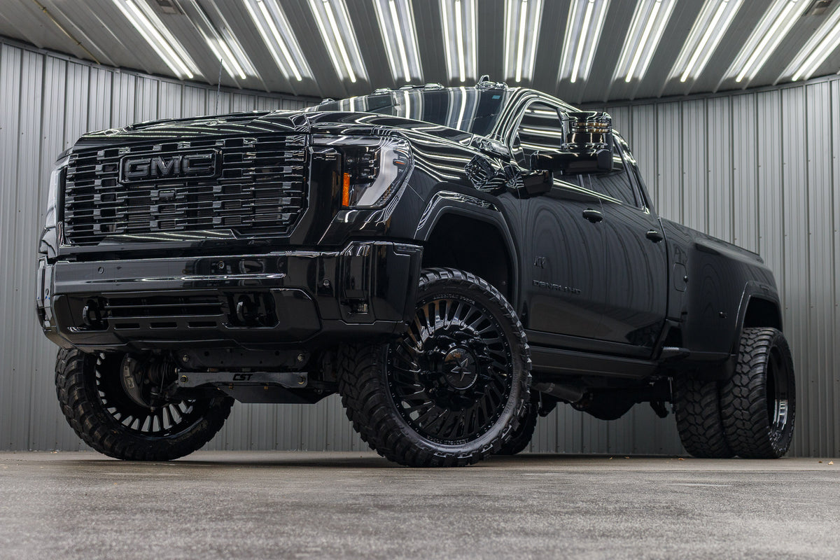 2025 GMC Sierra 3500 Denali Ultimate with a 4" CST lift kit, 26x8.25 American Force Thriller wheels, and 37" AMP Terrain Attack M/T A tires.
