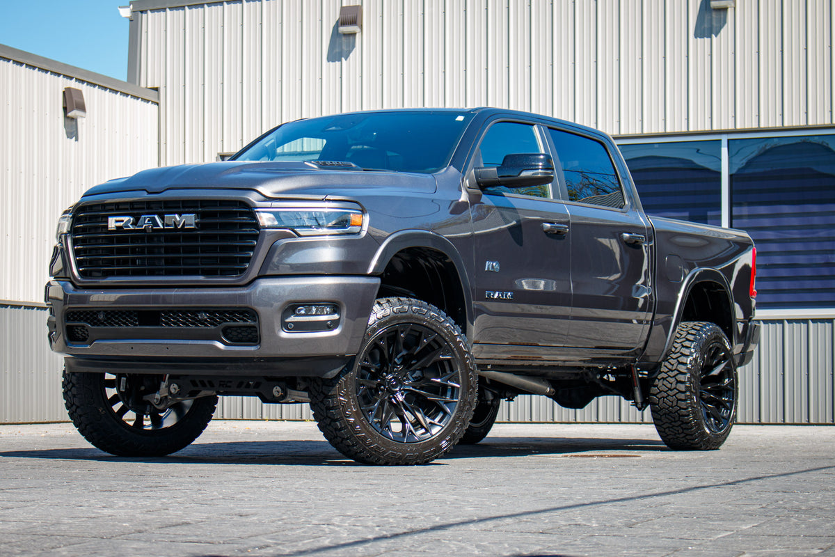 2025 Ram 1500 Laramie with a 6" Rough Country lift kit, 22x12 Fuel Flame wheels, and 35" Fury Country Hunter R/T tires.