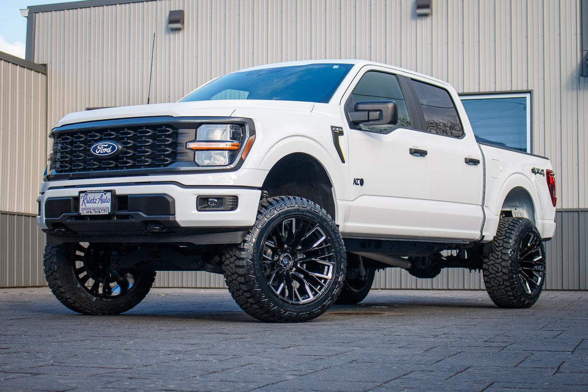 2024 Ford F-150 STX with a 6" Rough Country lift kit, 22x12 Fuel Rebar wheels, and 35" Fury Country Hunter R/T tires.