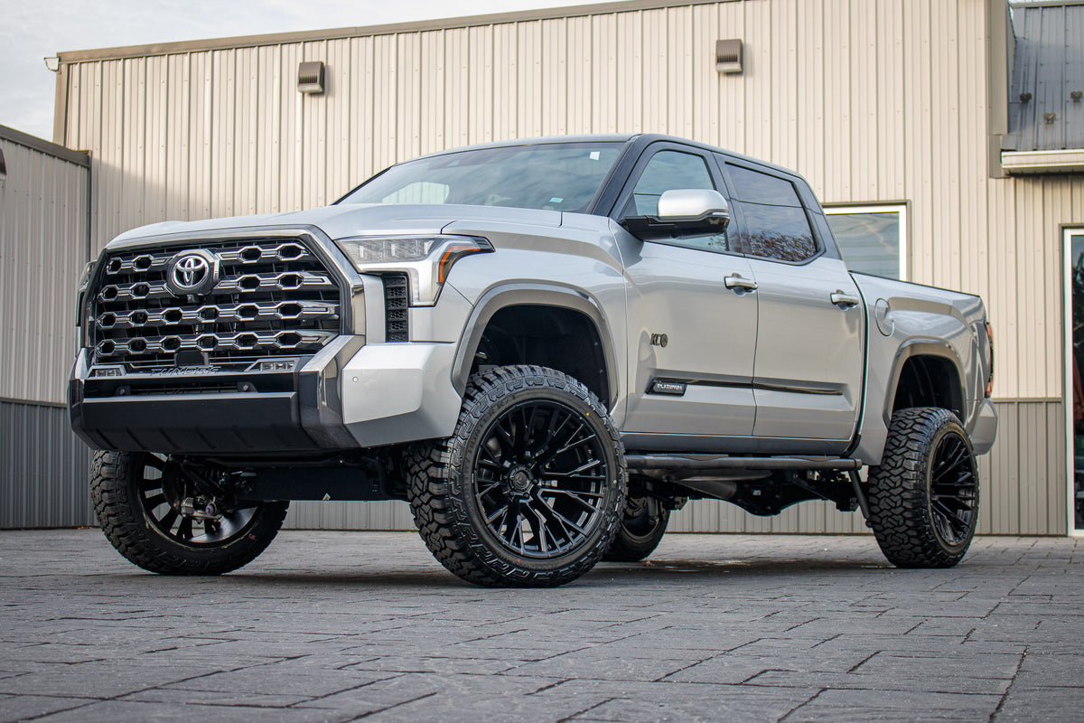 2023 Toyota Tundra Platinum with a 6" Rough Country lift kit, 22x12 Fuel Rebar wheels, and 35" Fury Country Hunter R/T tires.