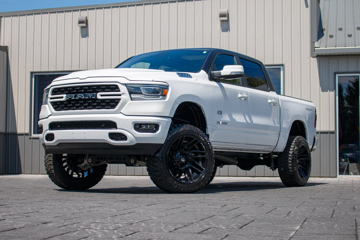 2022 Ram 1500 Lone Star with a 6" Rough Country lift kit, 22x12 Fuel Typhoon wheels, and Fury Country Hunter R/T tires.
