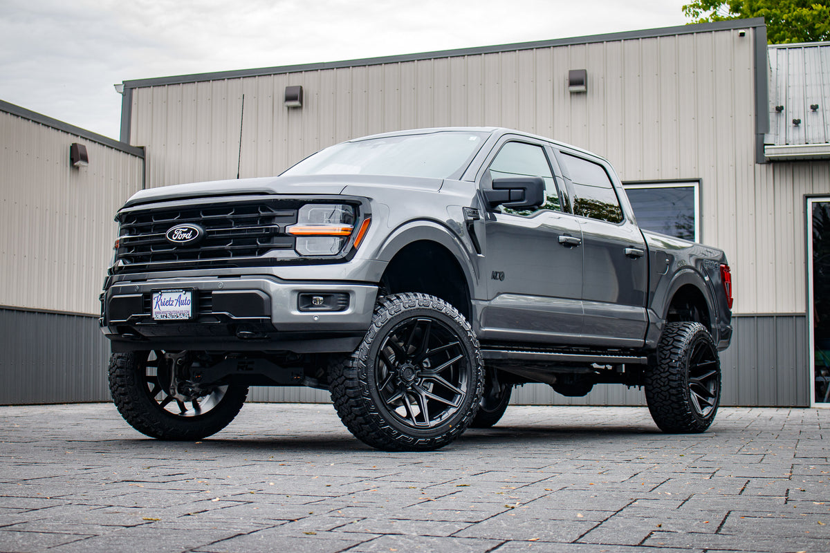 2024 Ford F-150 XLT with a 6" Rough Country lift kit, 22x12 Fuel Flux wheels, and 35" Fury Country Hunter R/T tires.