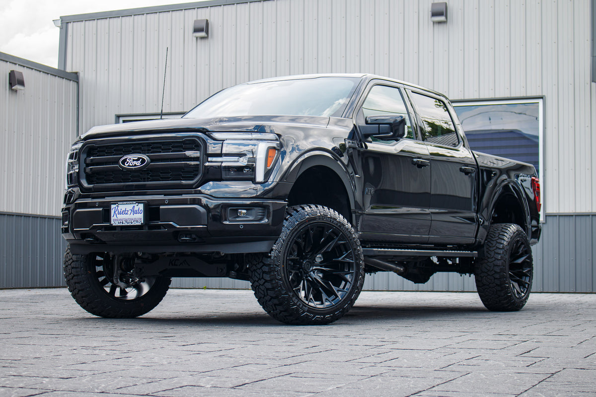2026 Ford F-150 Lariat with a 6" Rough Country lift kit, 22x12 Fuel Flame wheels, and 35" Fury Country Hunter R/T tires.