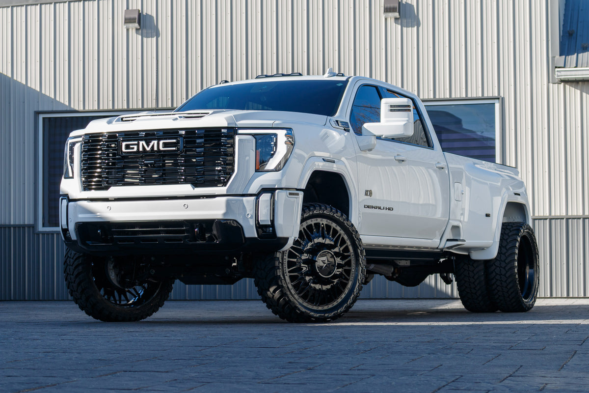 2025 GMC Sierra 3500 Denali Ultimate with a 4" CST lift kit, 26x8.25 American Force Plague wheels, and 37" AMP Terrain Attack M/T A tires.