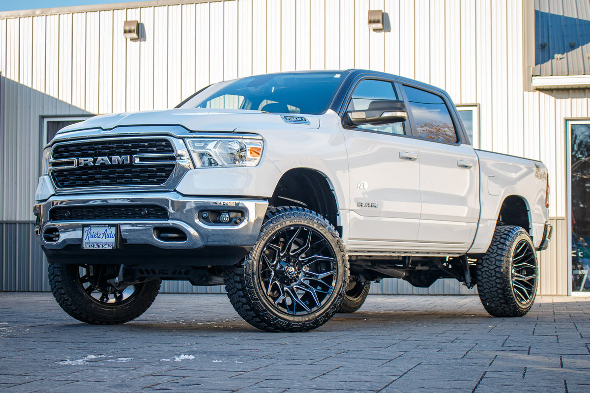 2022 Ram 1500 Big Horn with a 6" Rough Country lift kit, 22x12 Fuel Twitch wheels, and 35" Fury Country Hunter R/T tires.