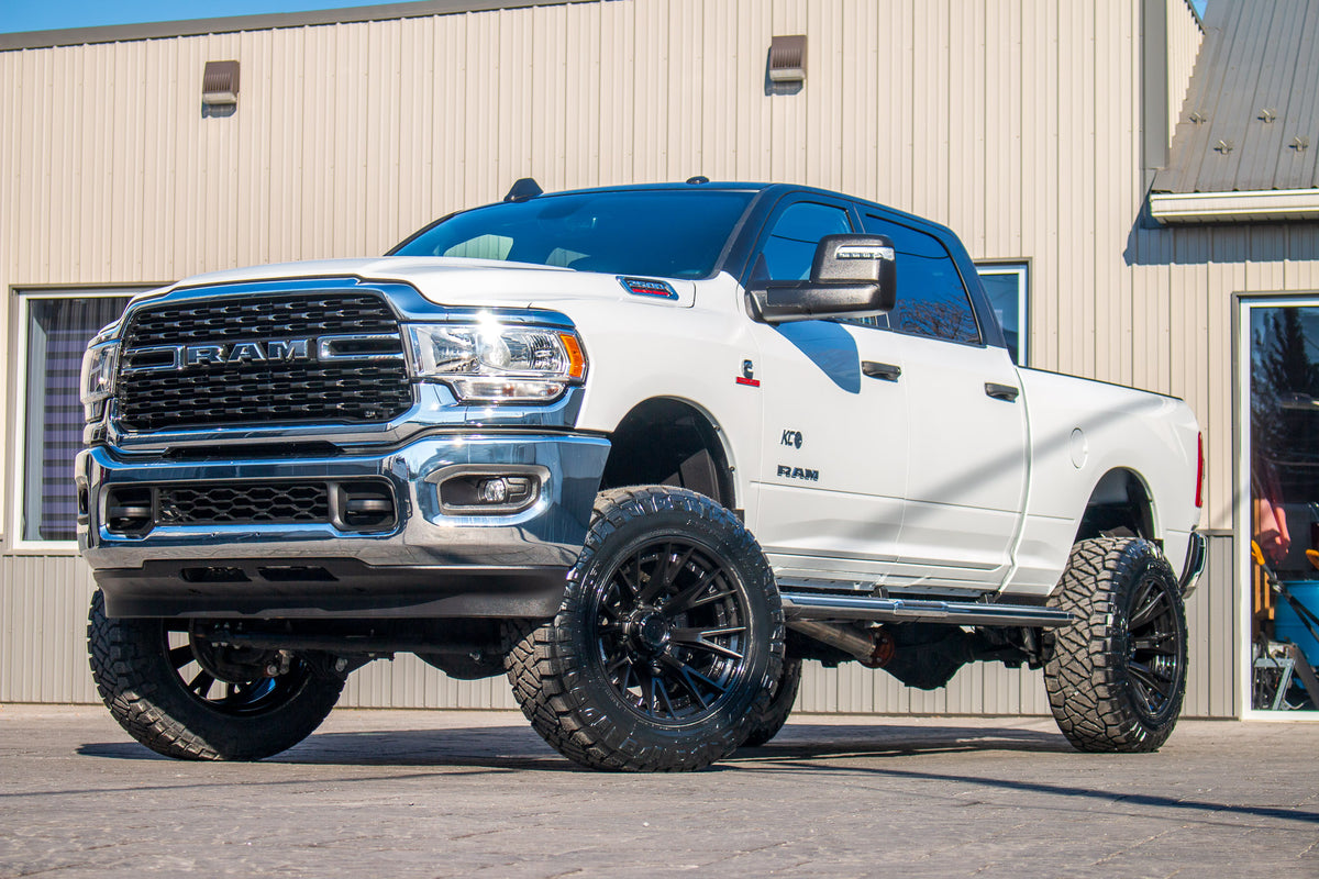 2024 Ram 2500 Big Horn with a 5" Rough Country lift kit, 22x12 Fuel Catalyst wheels, and 37" Nitto Ridge Grappler tires.