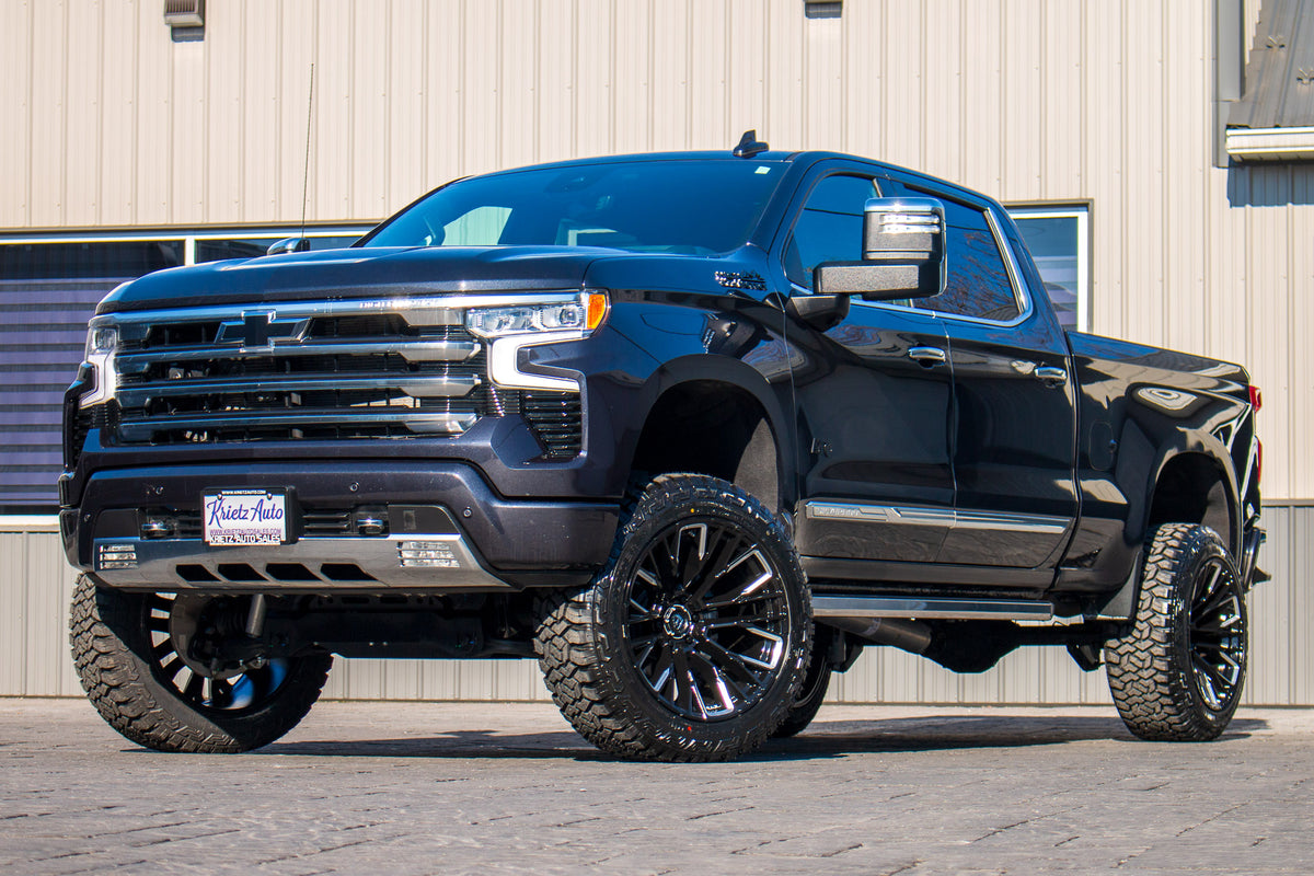 2023 Chevrolet Silverado 1500 High Country with a 6" Rough Country lift kit, 22x12 Fuel Rebar wheels, and 35" Fury Country Hunter R/T tires.