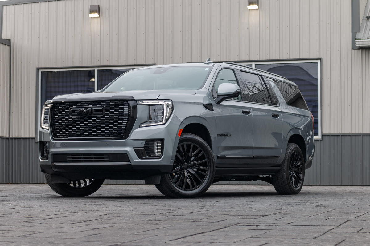 2024 GMC Yukon XL Denali Ultimate with GMC Factory suspension, 22x9 GMC Stock wheels, and Bridgestone Alenza tires.