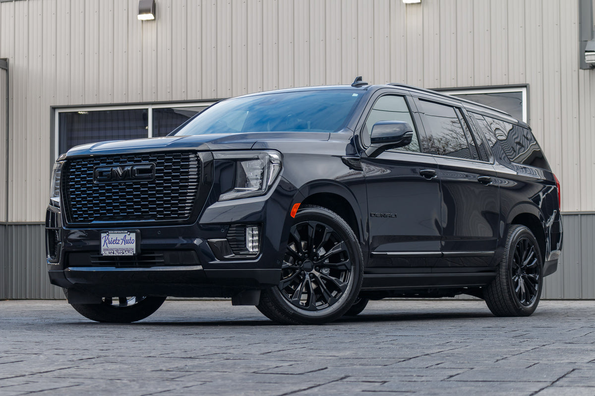 2024 GMC Yukon XL Denali Ultimate with GMC Factory suspension, 22x9 GMC Stock wheels, and Bridgestone Alenza tires.
