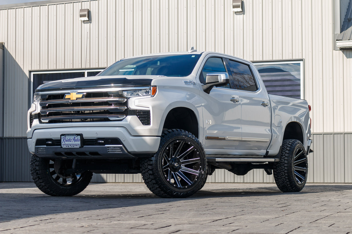 2022 Chevrolet Silverado 1500 High Country with a 6" Rough Country lift kit, 22x12 Fuel Contra wheels, and 35" Fury Country Hunter R/T tires.