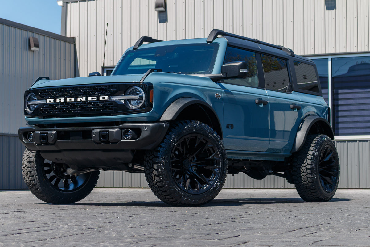 2023 Ford Bronco Wildtrak with a 2.25" Zone lift kit, 22x12 Fuel Flame wheels, and 35" Fury Country Hunter R/T tires.