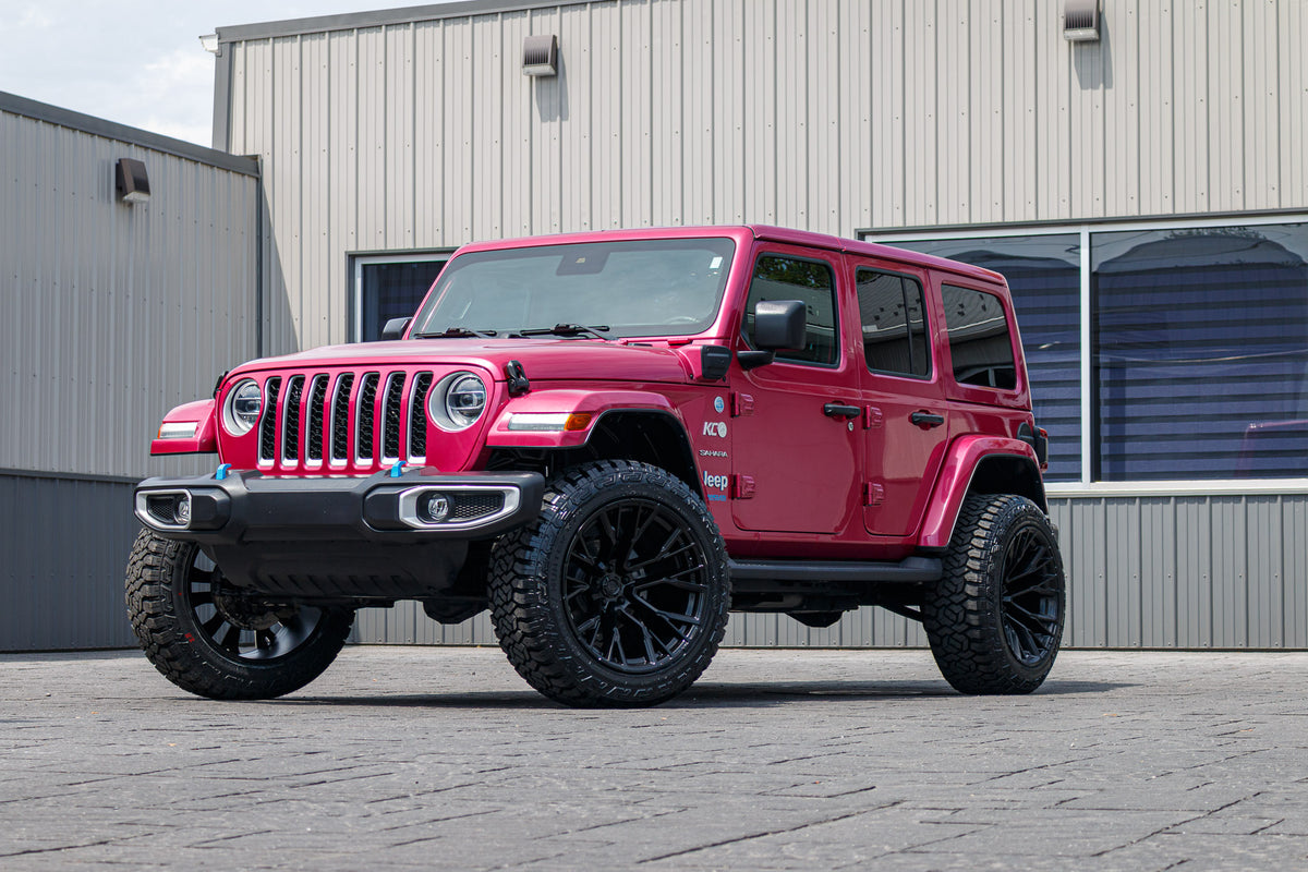 2022 Jeep Wrangler Unlimited Sahara 4XE with a 2.5" Rough Country lift kit, 22x12 Fuel Rebar wheels, and 35" Fury Country Hunter tires.