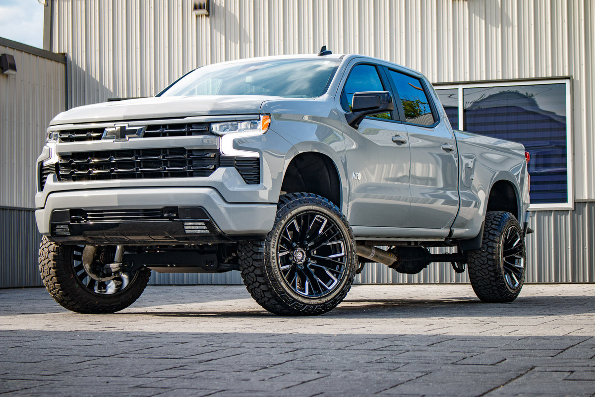 2024 Chevrolet Silverado 1500 Custom Trail Boss with a 6" Rough Country lift kit, 22x12 Fuel Rebar wheels, and 35" Fury Country Hunter R/T tires.