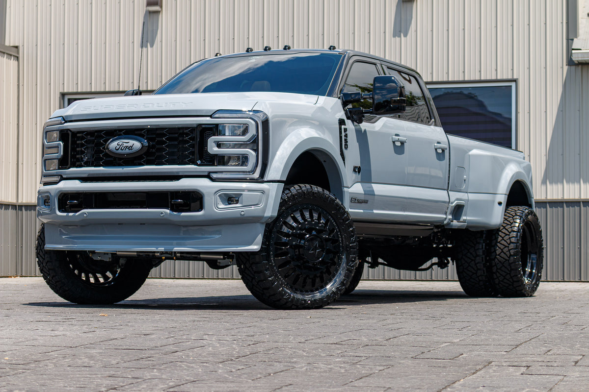 2025 Ford F-450 Lariat with a 4" Wicked lift kit, 24x8.25 American Force Massive wheels, and 37" Nitto Ridge Grappler tires.
