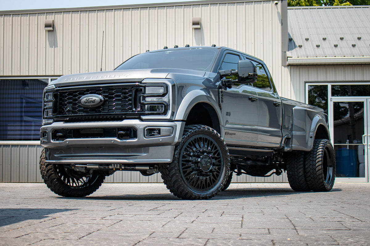 2024 Ford F-450 XLT with a 4" Wicked lift kit, 26x8.25 American Force Business wheels, and 37" AMP Terrain Attack M/T A tires.