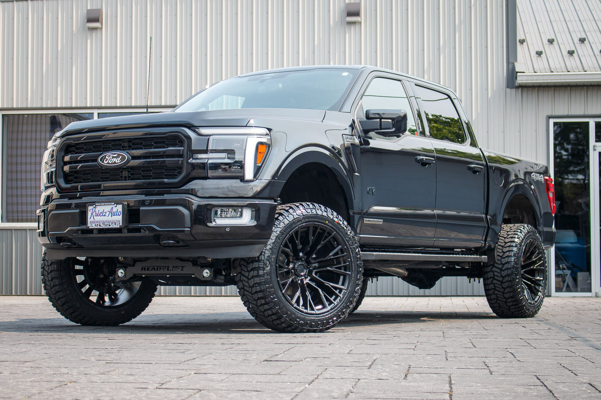 2024 Ford F-150 Lariat with a 6" Readylift lift kit, 22x12 Fuel Rebar wheels, and 35" Avix Trailtek R/T tires.