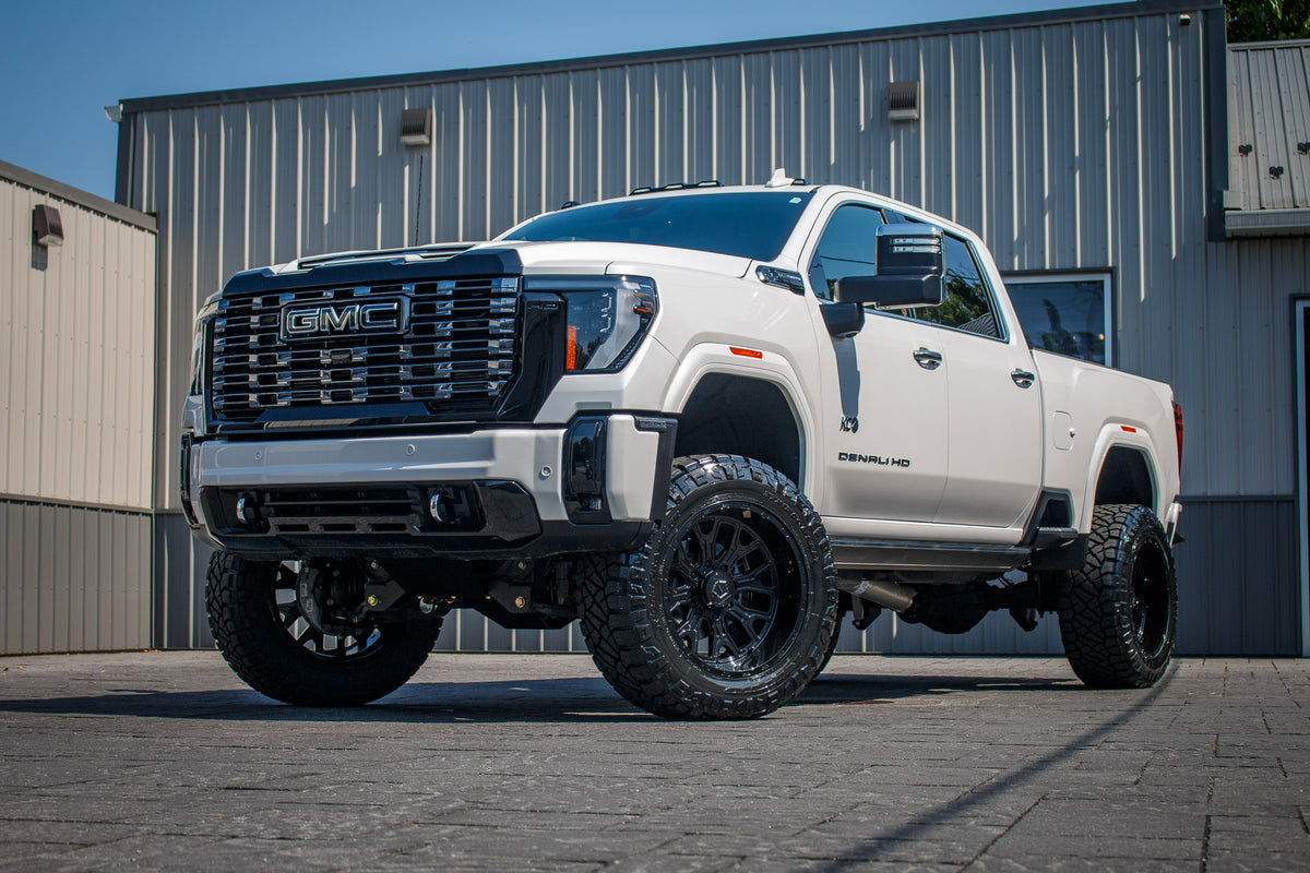 2025 GMC Sierra 3500 Denali Ultimate with a 5" BDS lift kit, 22x12 TIS 560B wheels, and 37" Nitto Ridge Grappler tires.
