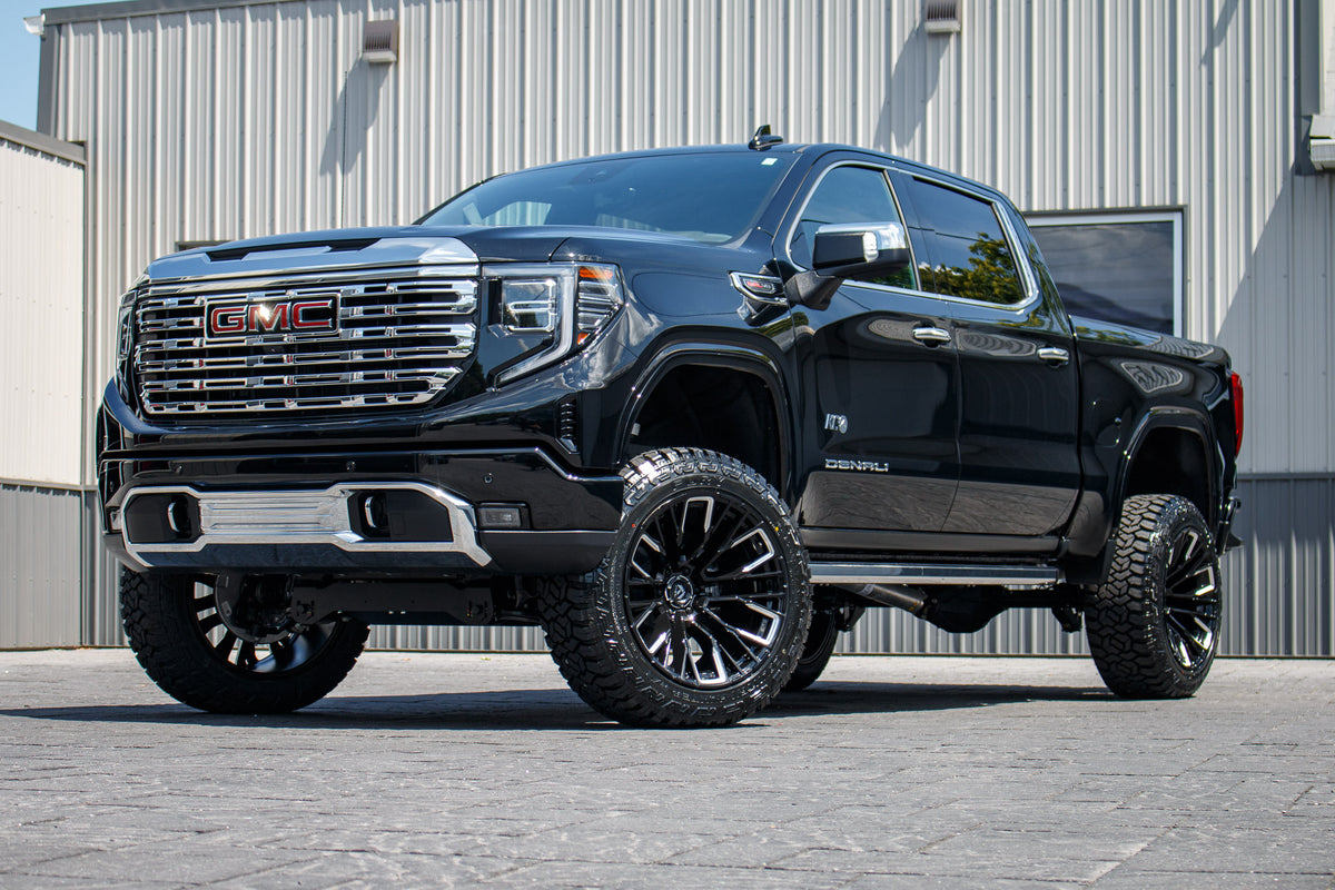 2024 GMC Sierra 1500 Denali Black with 6 inch Rough Country Lift kit and 22x12 Fuel Rebar Wheels and 35 Inch Fury Country Hunter R/T Tires