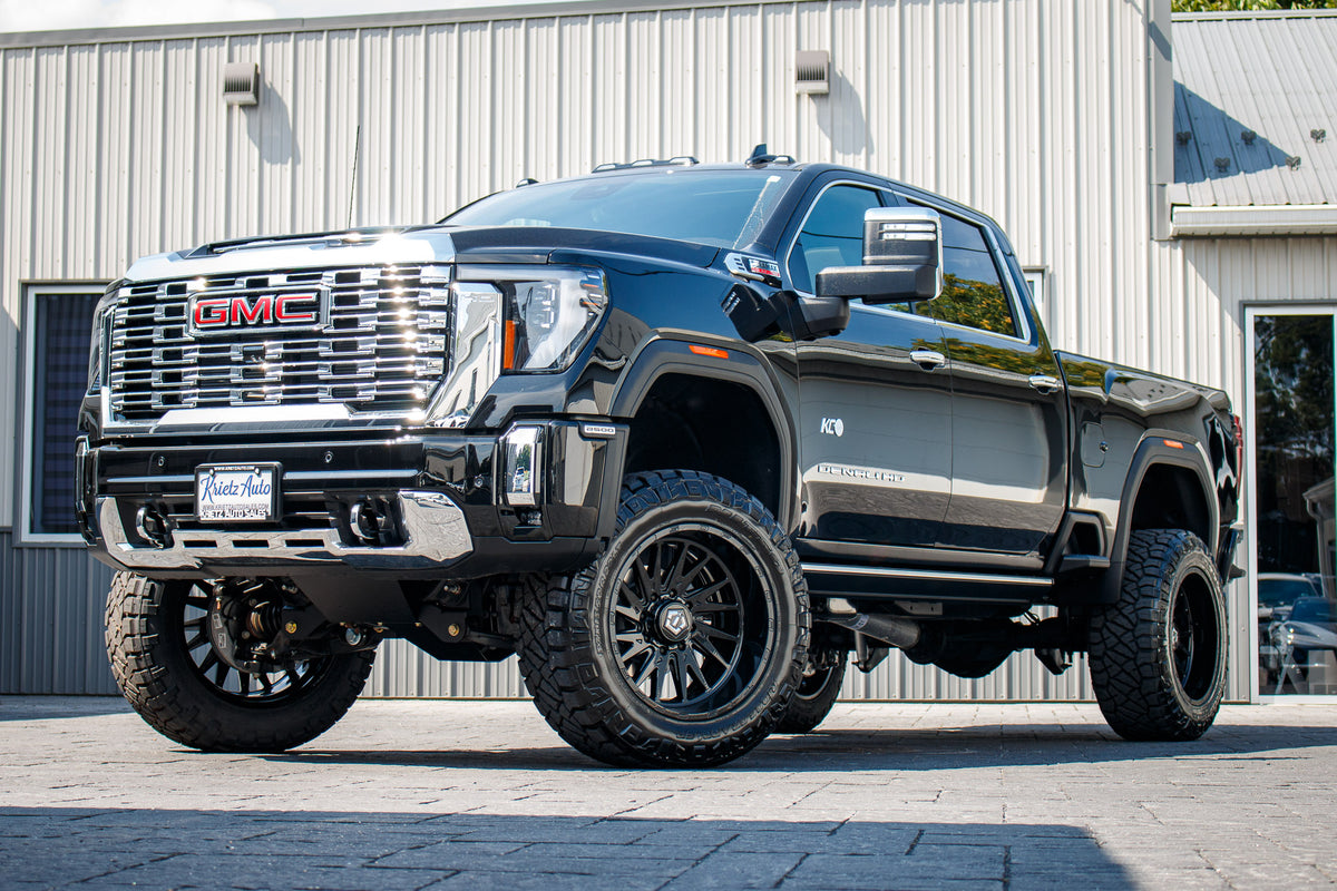 2025 GMC Sierra 2500 Denali with a 6" BDS lift kit, 22x12 TIS 547B wheels, and 35" Nitto Ridge Grappler tires.