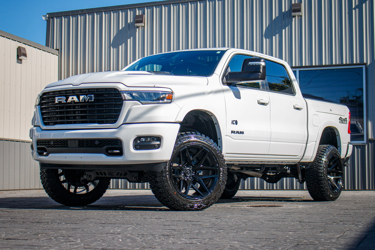 2025 Ram 1500 Laramie with a 6" Rough Country lift kit, 22x12 Fuel Flux wheels, and 35" Fury Country Hunter R/T tires.
