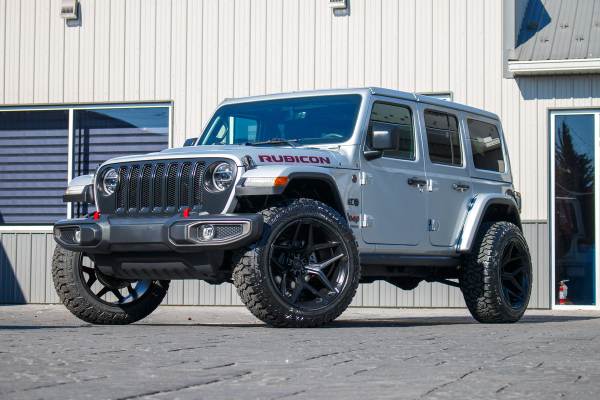 2022 Jeep Wrangler Unlimited Rubicon with Jeep Stock suspension, 22x12 Fuel Flux wheels, and 35" Fury Country Hunter R/T tires.