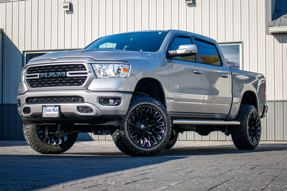 2024 Ram 1500 Lone Star with a 6" Rough Country lift kit, 22x12 Fuel Strike wheels, and 35" Fury Country Hunter tires.