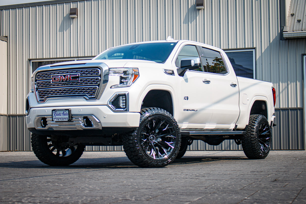 2021 GMC Sierra 1500 Denali with 6" Rough Country suspension, 22x12 Fuel Flame wheels, and 35" Fury Country Hunter R/T tires.