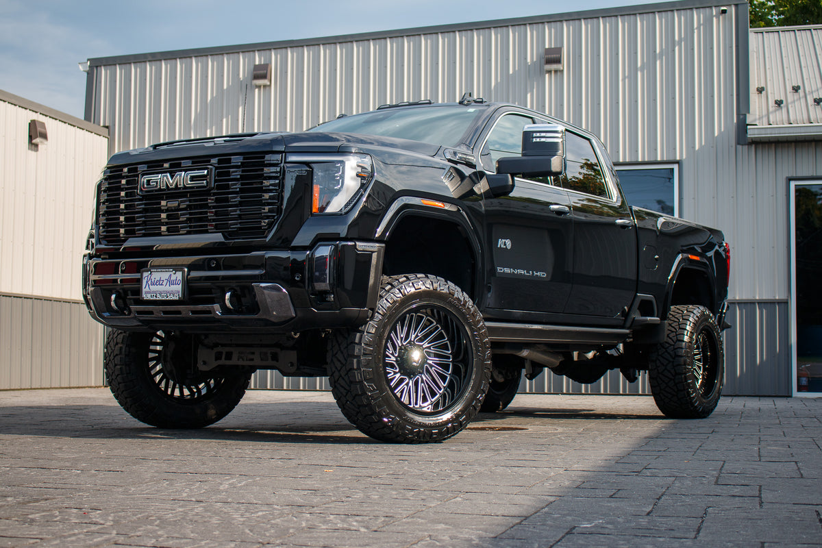 2024 GMC Sierra 2500 Denali Ultimate with a 5" Rough Country lift kit, 22x12 TIS 553BM wheels, and 37" Nitto Ridge Grappler tires.