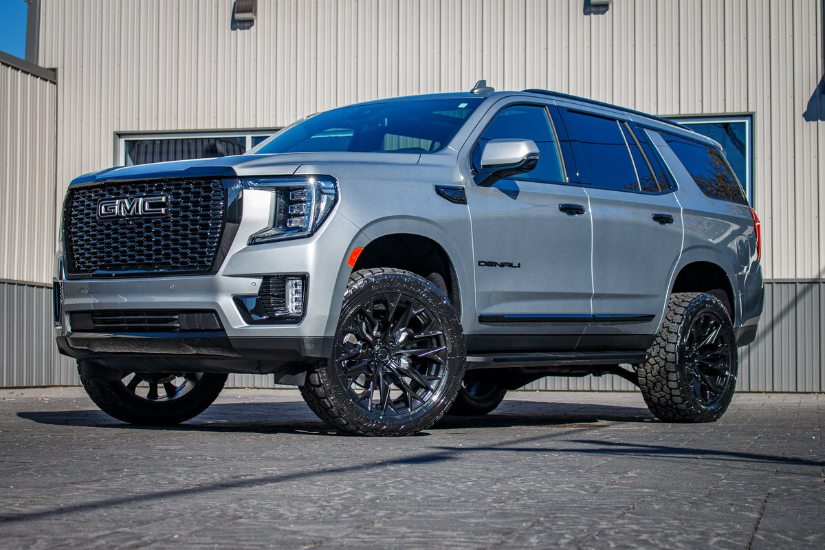 2024 GMC Yukon Denali with a 3" ReadyLift lift kit, 22x10 Fuel Flame wheels, and 295/50 Toyo Open Country A/T III tires.