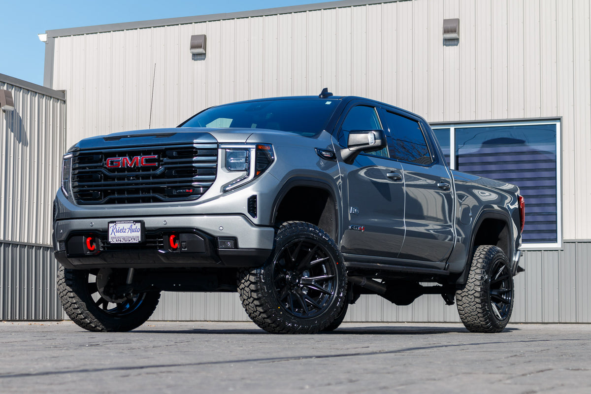 2024 GMC Sierra 1500 AT4 with a 6" Rough Country lift kit, 22x12 Fuel Catalyst wheels, and 35" Fury Country Hunter R/T tires.