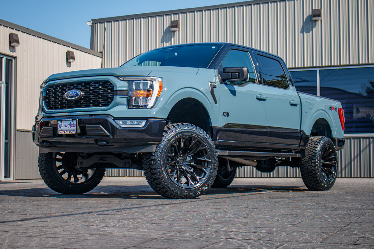 2023 Ford F-150 XLT with a 6" Rough Country lift kit, 22x12 Fuel Flame wheels, and 35" Fury Country Hunter R/T tires.