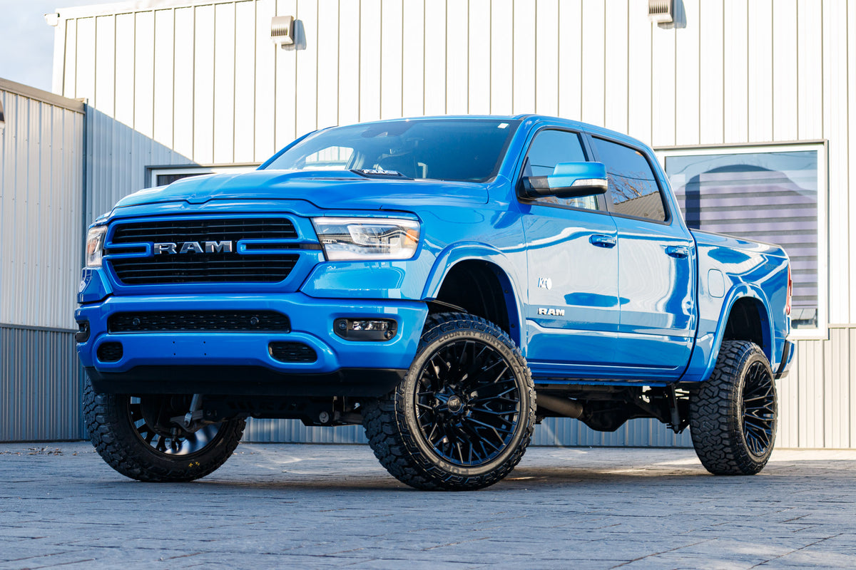 2022 Ram 1500 Laramie with a 6" Rough Country lift kit, 22x12 Fuel Strike wheels, and 35" Fury Country Hunter R/T tires.