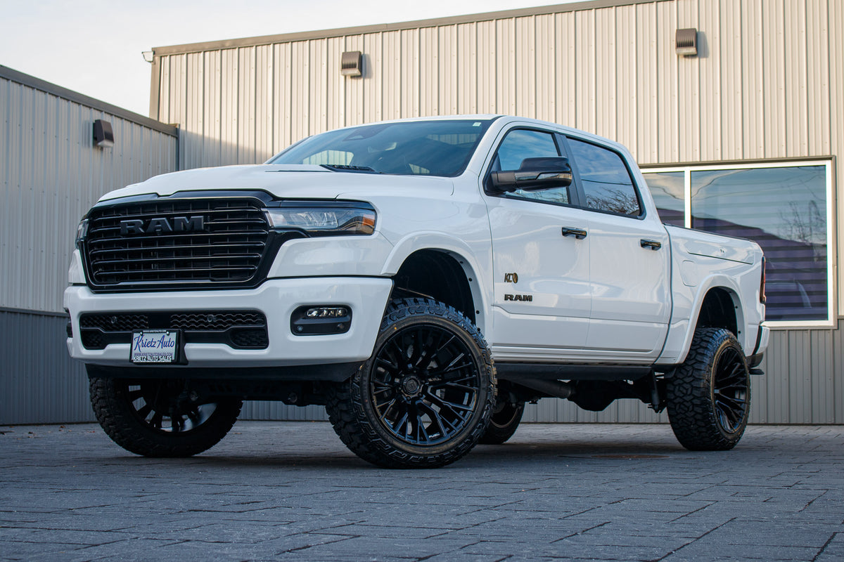 2025 Ram 1500 Laramie with a 6" Rough Country lift kit, 22x12 Fuel Rebar wheels, and 35" Fury Country Hunter R/T tires.
