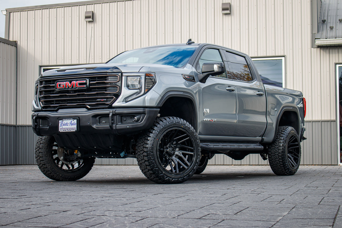 2024 GMC Sierra 1500 AT4X with a 4" ReadyLift lift kit, 22x12 TIS 554B wheels, and 35" Fury Country Hunter R/T tires.