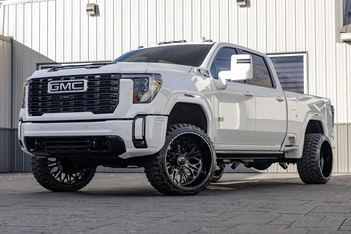 2024 GMC Sierra 2500 Denali Ultimate with a 3" Cognito Leveling kit, 24x14 American Force Intrepid wheels, and 33" Fury Country Hunter M/T tires.