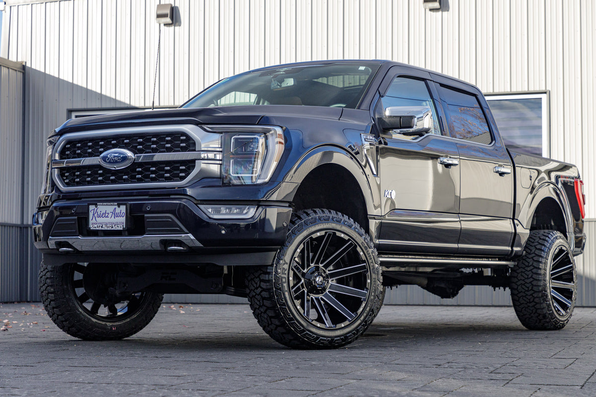 2023 Ford F-150 Platinum with a 6" Rough Country lift kit, 22x12 Fuel Contra wheels, and 35" Fury Country Hunter R/T tires.