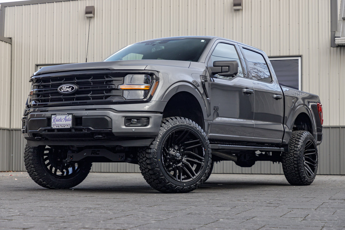 2024 Ford F-150 XLT with a 6" Rough Country lift kit, 22x12 Fuel Typhoon wheels, and 35" Fury Country Hunter R/T tires.